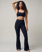 Volsa Ribbed Flare Leggings in black, worn, side