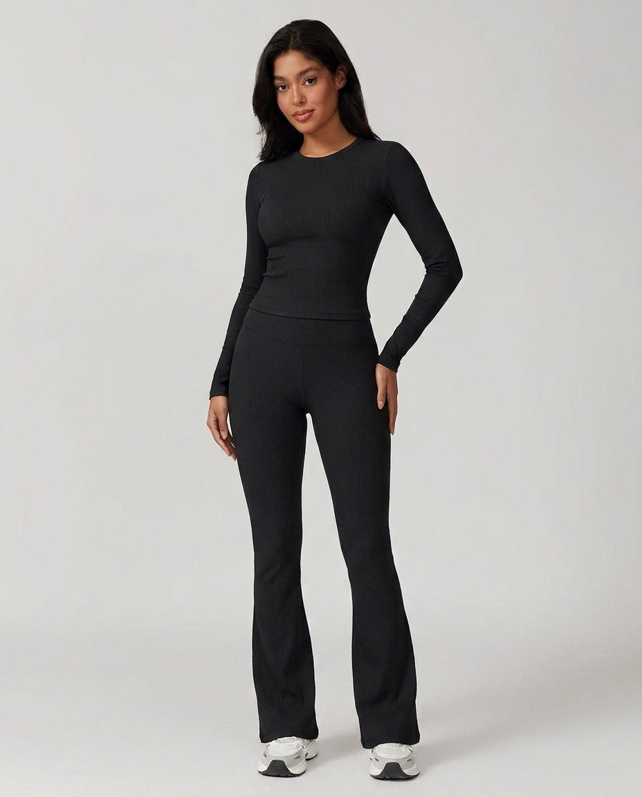 Volsa Ribbed Tee and Flare Leggings Set in black, worn, front