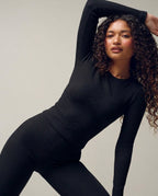 Volsa Ribbed Tee and Flare Leggings Set in black, worn, side