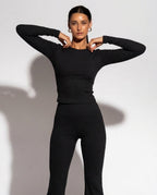 Volsa Ribbed Tee and Flare Leggings Set in black, worn, detail
